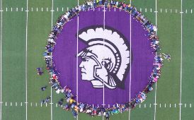  aerial view of students around mascot on football field